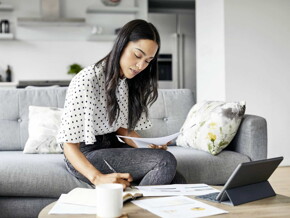 woman writing on a book