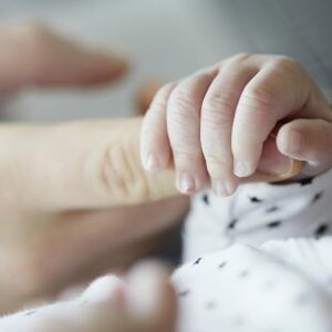 Baby holding mothers finger Baby holding mothers finger