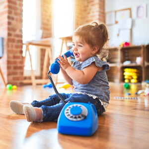 Baby girl with telephone