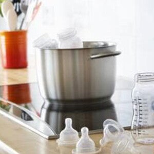 Preparing baby formula in the kitchen.