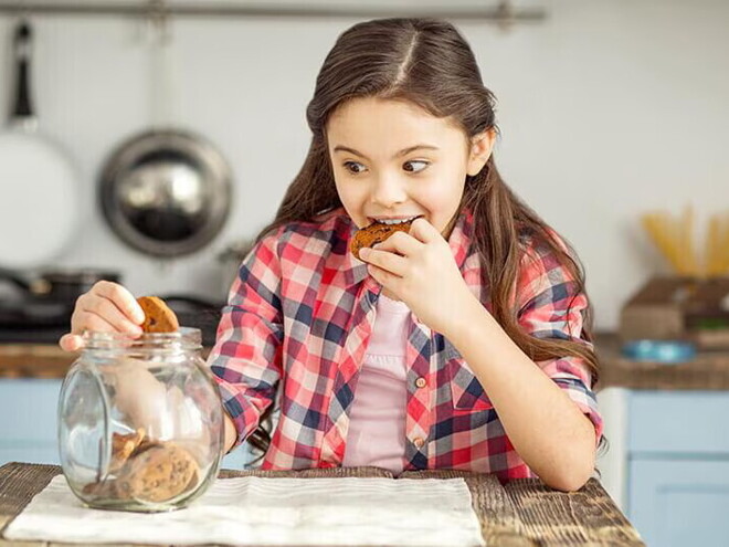 girl eating cookie