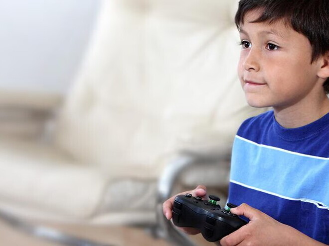 Kid playing videogame