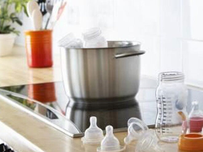 Preparing baby formula in the kitchen.
