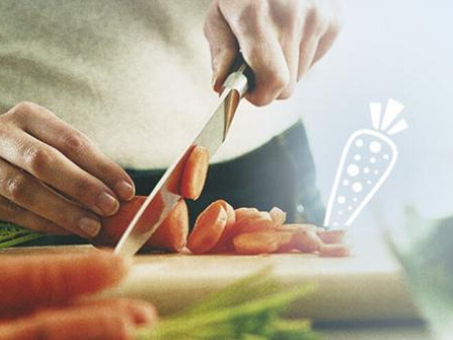 no man cutting carrots